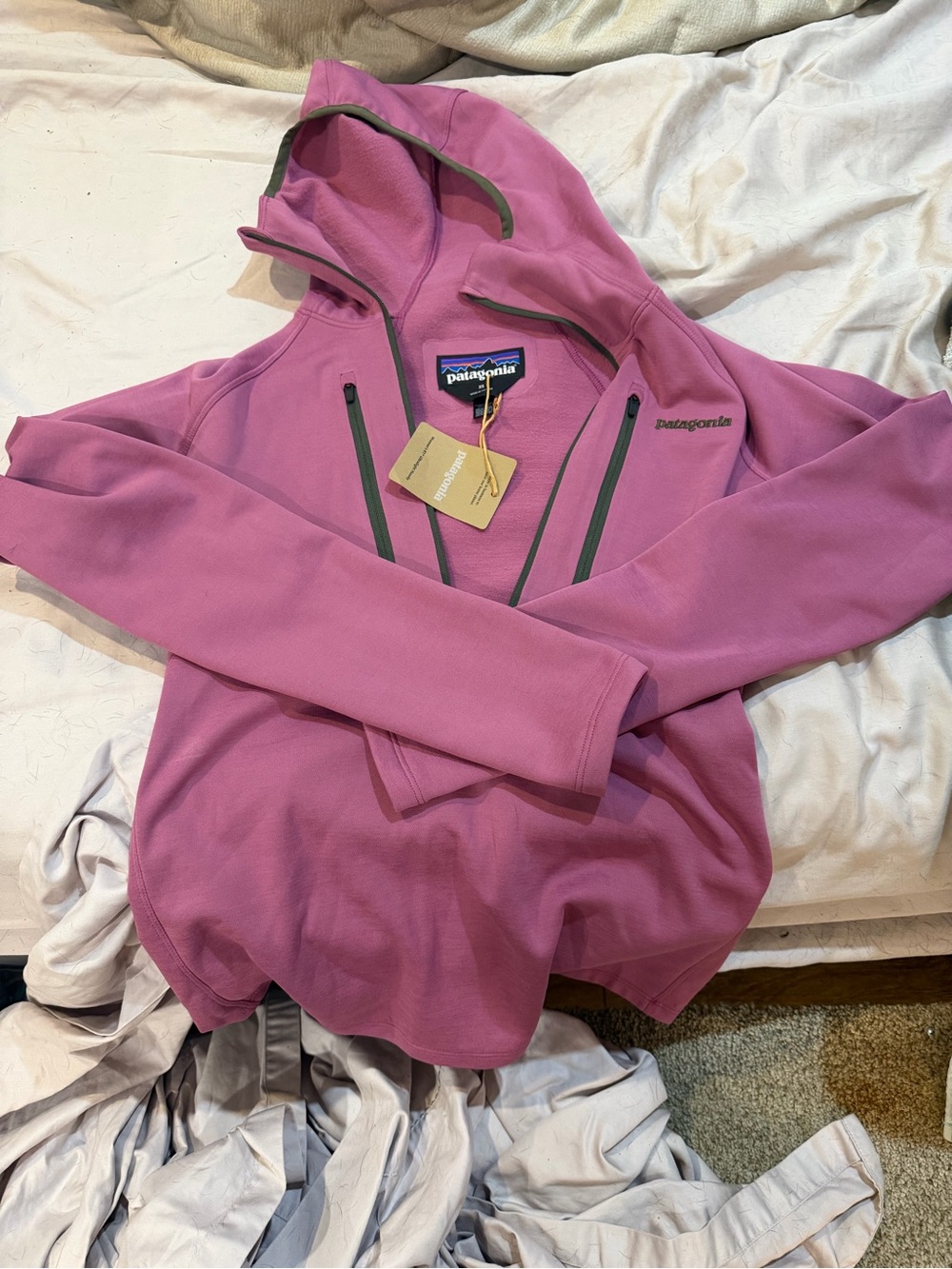 Patagonia Women's Pink Hooded Fleece zip up jacket.